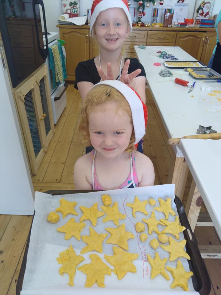 A child proudly showing their creation